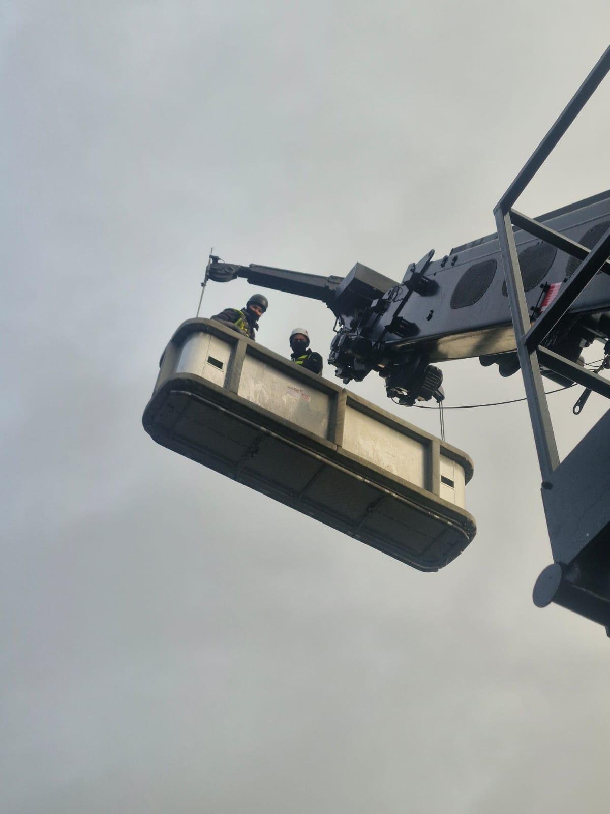Crew lifted in a MEWP basket on a high-level access job